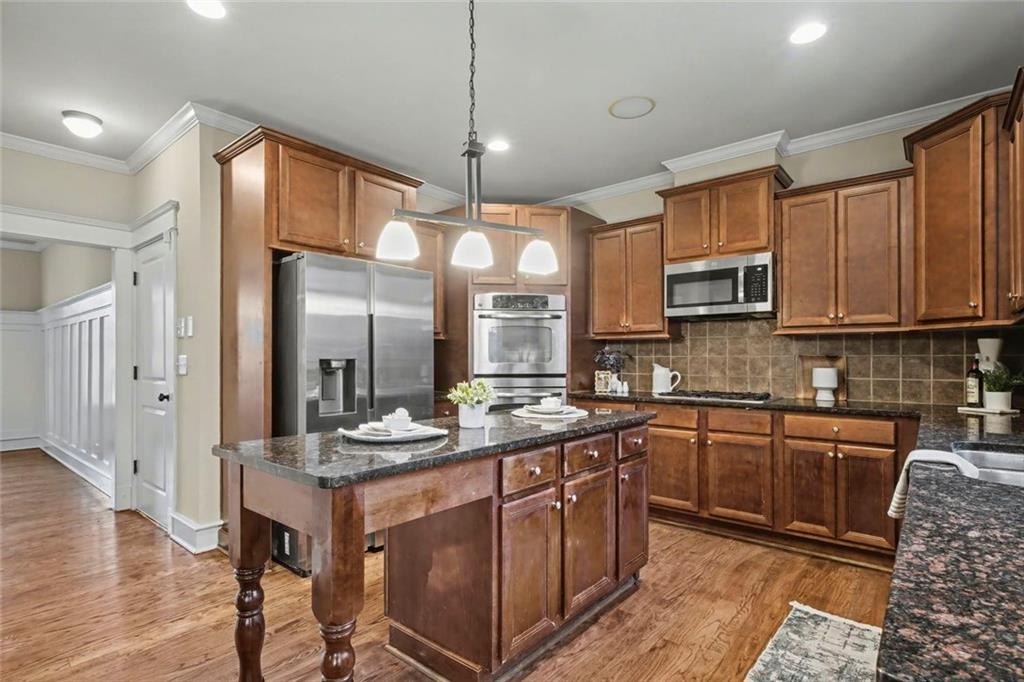 3105 Brick Lane Decatur, GA 30033 - Photo 31 of 72 a kitchen with stainless steel appliances granite countertop wooden cabinets granite counter tops and a hard wood floors