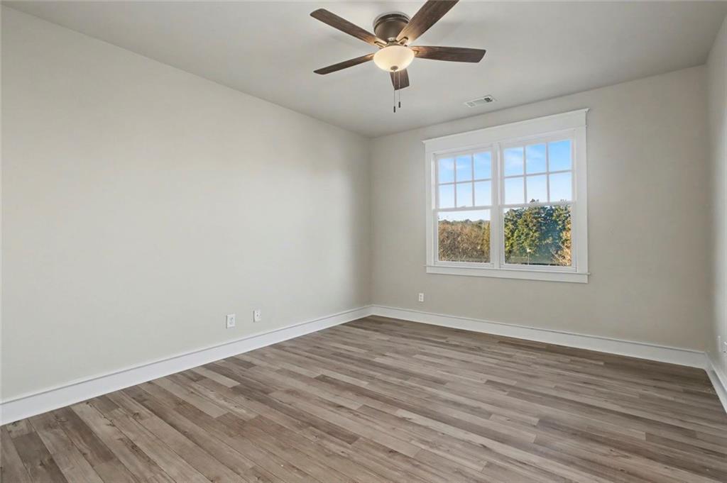 3105 Brick Lane Decatur, GA 30033 - Photo 53 of 72 wooden floor in an empty room with a window