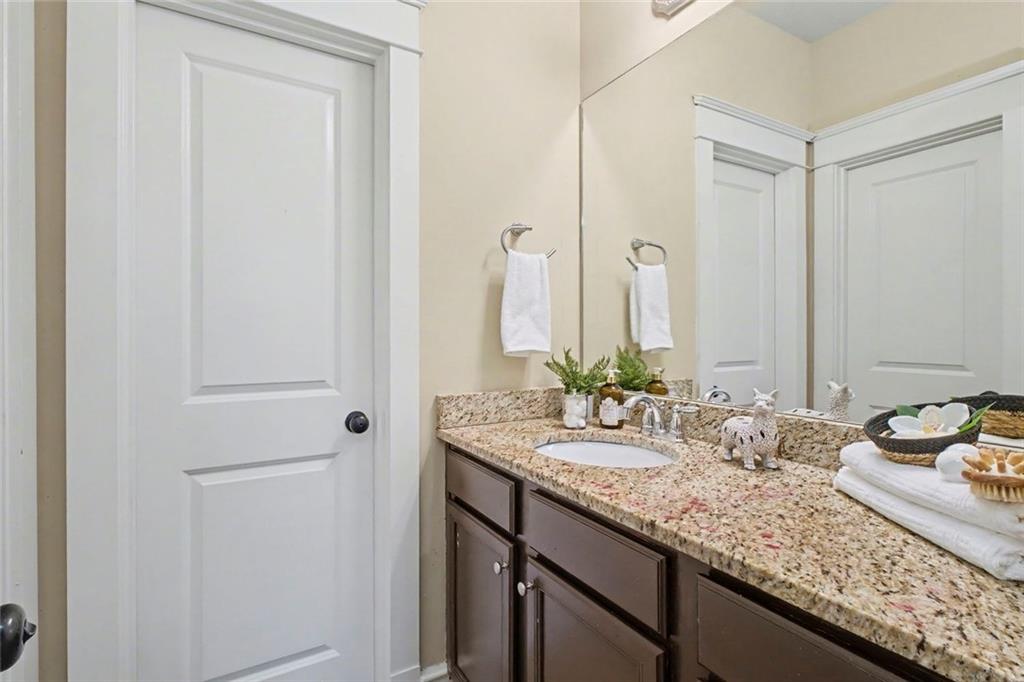 3105 Brick Lane Decatur, GA 30033 - Photo 60 of 72 a bathroom with a granite countertop sink and a mirror