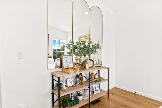 a view of a room with a table and chairs