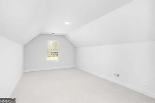 a view of a room with large windows