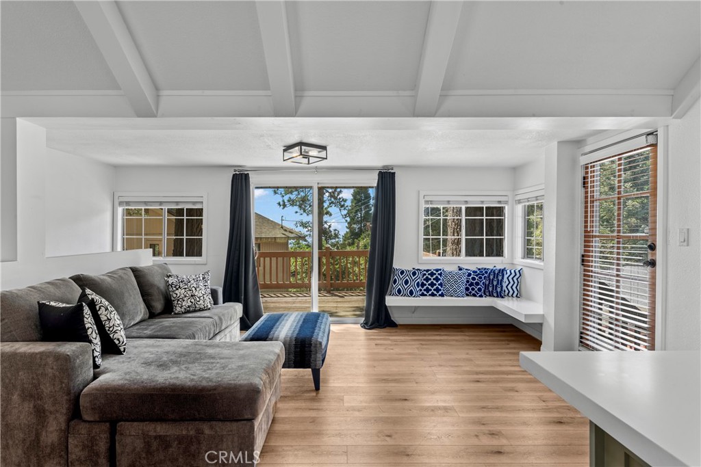 1139 Bear Springs Road Twin Peaks, CA 92391 - Photo 11 of 45 a living room with furniture and a large window