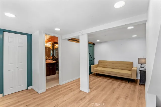 a bathroom with a sink mirror vanity and toilet