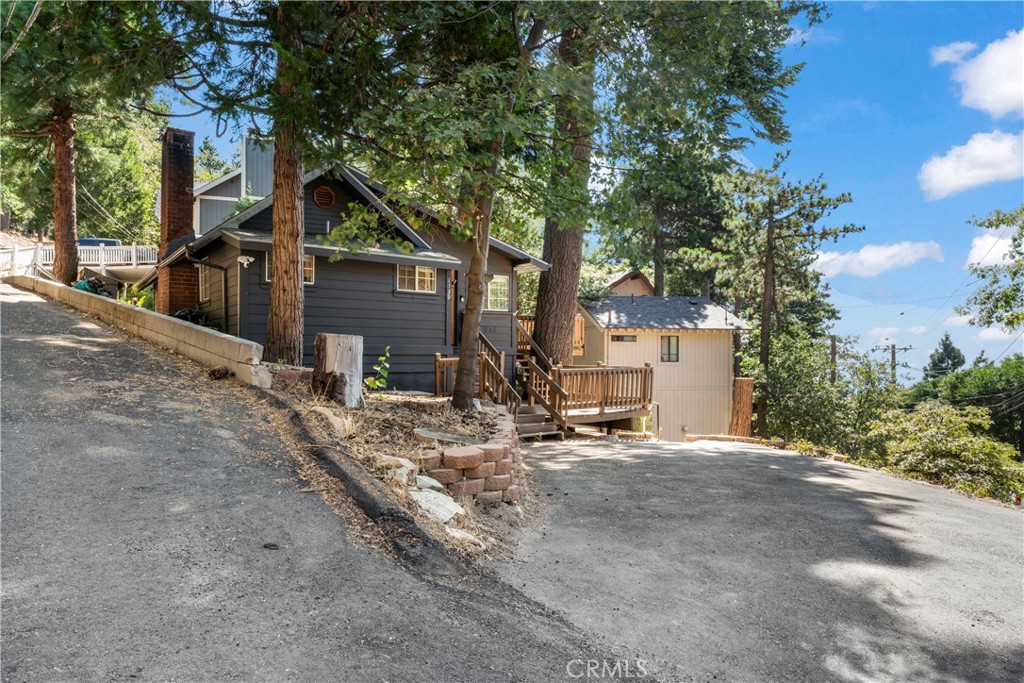 1139 Bear Springs Road Twin Peaks, CA 92391 - Photo 42 of 45 a view of a house with a yard and tree