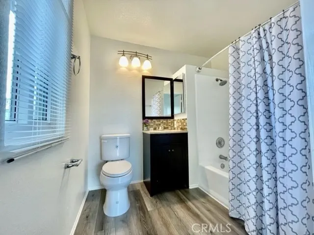 a bathroom with a toilet and a sink