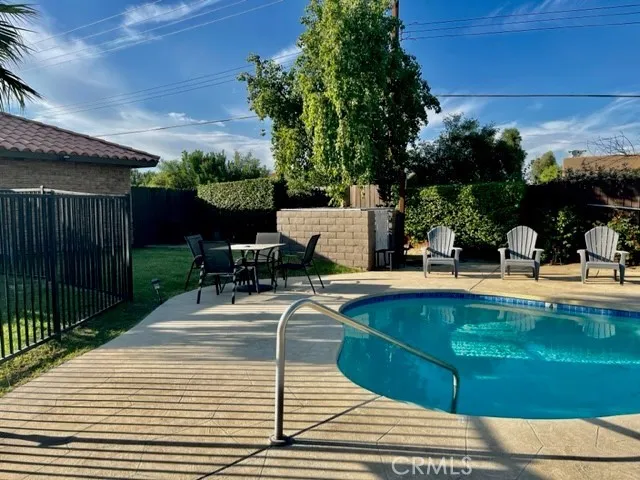 a view of a swimming pool with a patio