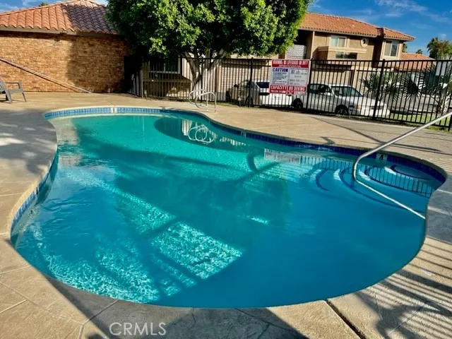 a view of a swimming pool with a garden