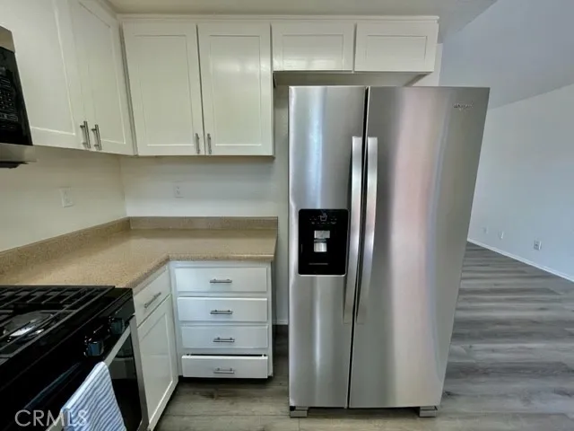a kitchen with appliances and cabinets