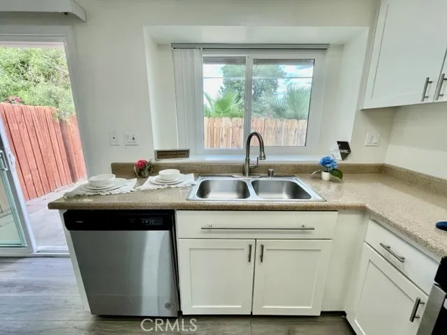 a kitchen with a sink and cabinets