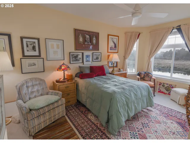 a bedroom with a bed couch and window