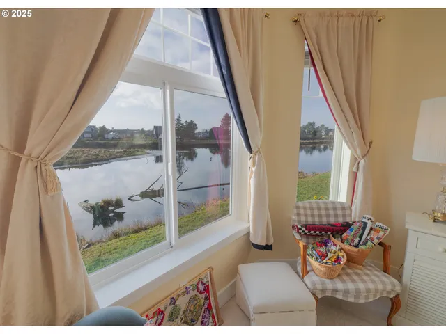 a living room with furniture and a lamp