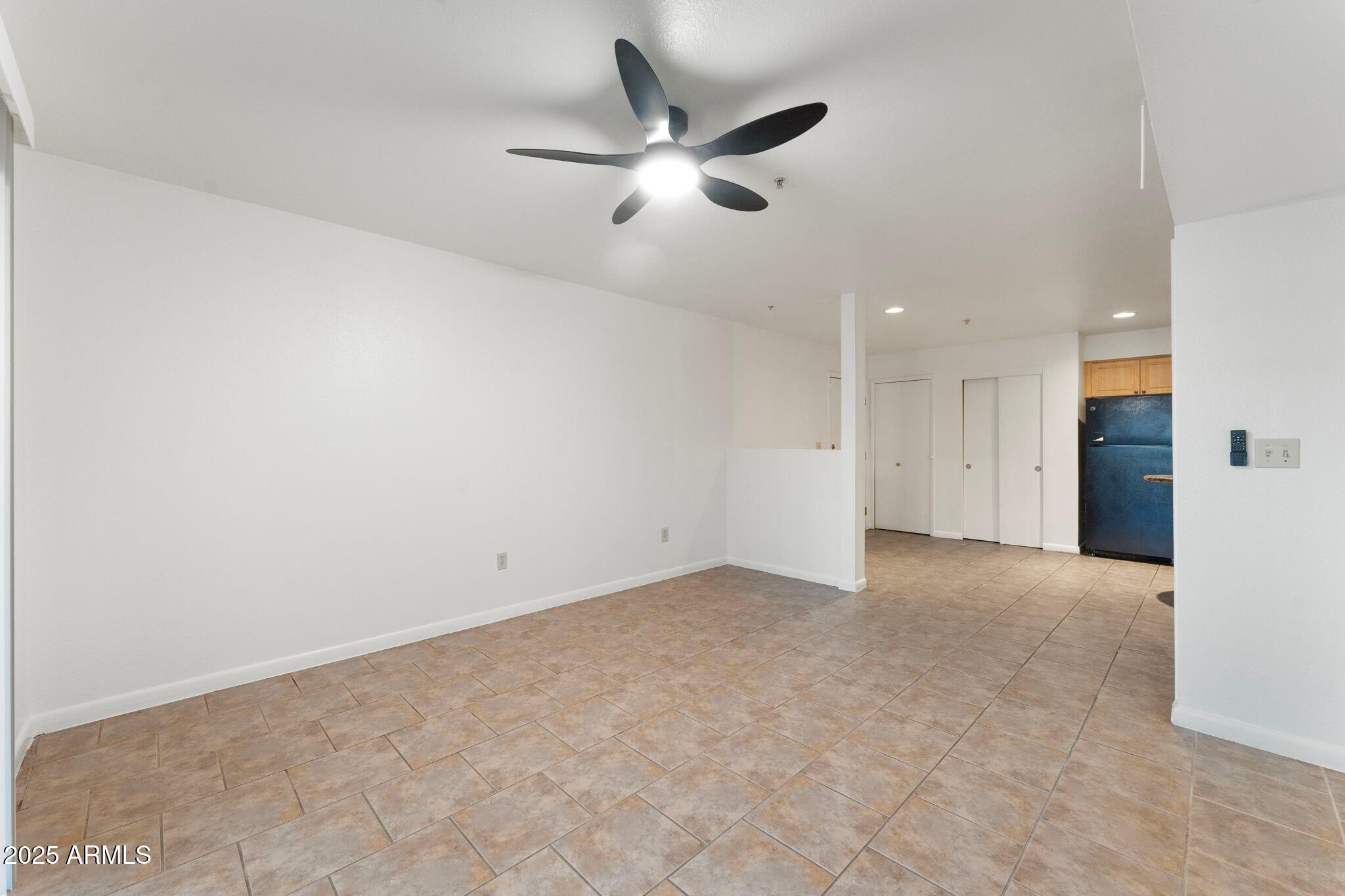 1005 East 8th Street, Unit 1012 Tempe, AZ 85281 - Photo 4 of 16 an empty room with closet and ceiling fan