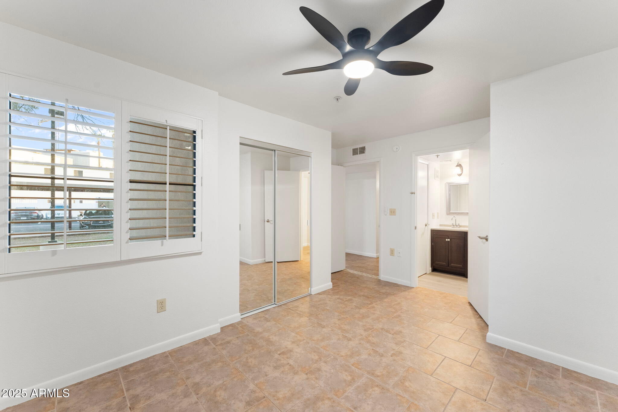 1005 East 8th Street, Unit 1012 Tempe, AZ 85281 - Photo 8 of 16 a view of an empty room with a window