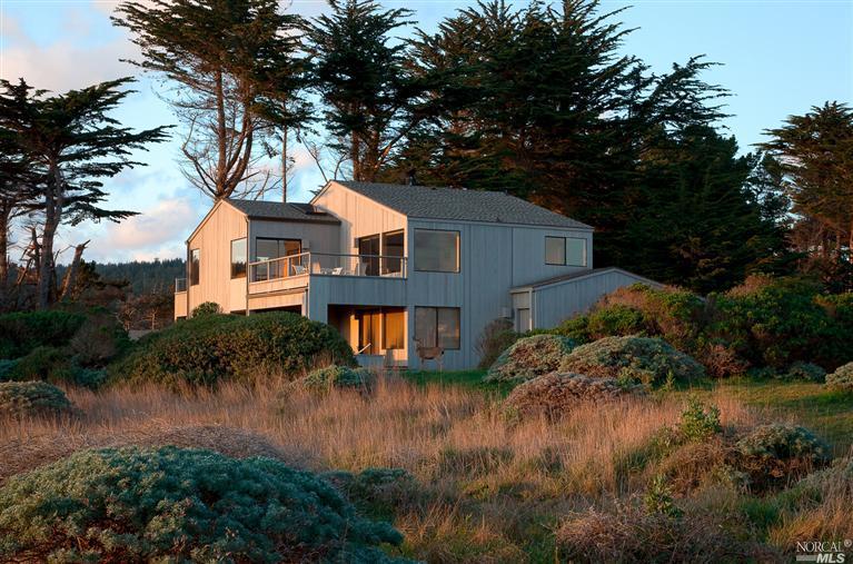 This beautiful home is located on the bluff trail in the north end of Sea Ranch and is nestled against the signature hedgerow.  The home is a few steps away from the Gualala County Park and enjoys views up and down the coast.  This property has many extra features such as vaulted wood ceilings, , 4 oceanview decks, an oversized garage and plenty of dry storage sheds for bikes, hobby equipment, etc.