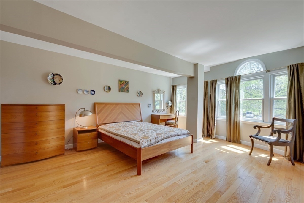 75 Page Road, Unit 16 Bedford, MA 01730 - Photo 16 of 27 a bedroom with a bed and large windows