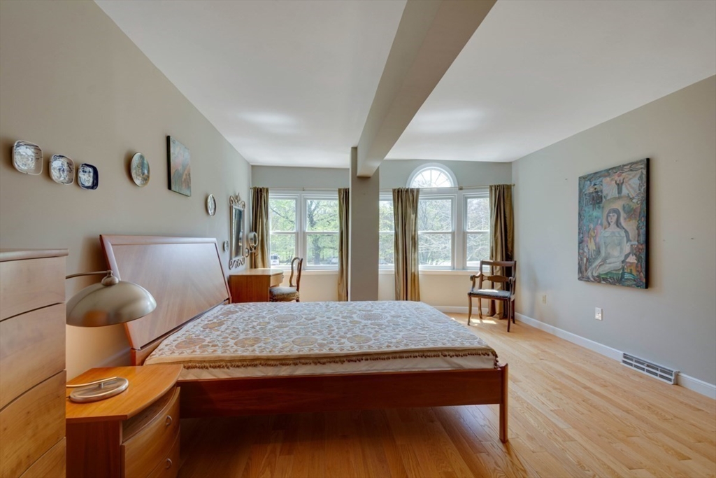 75 Page Road, Unit 16 Bedford, MA 01730 - Photo 17 of 27 a living room with furniture and wooden floor