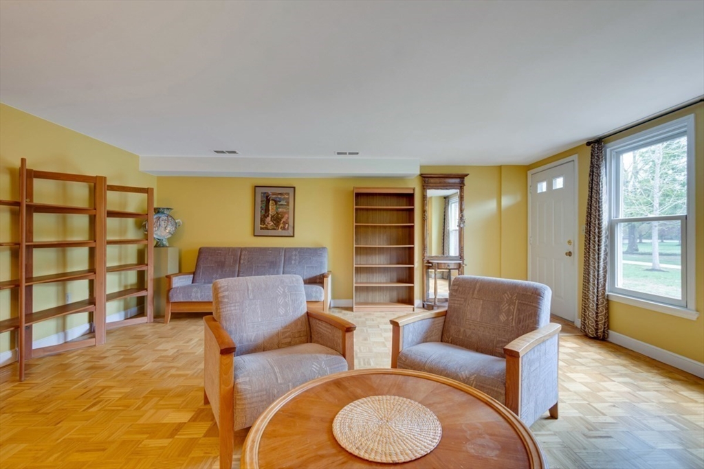 75 Page Road, Unit 16 Bedford, MA 01730 - Photo 4 of 27 a living room with furniture and a window