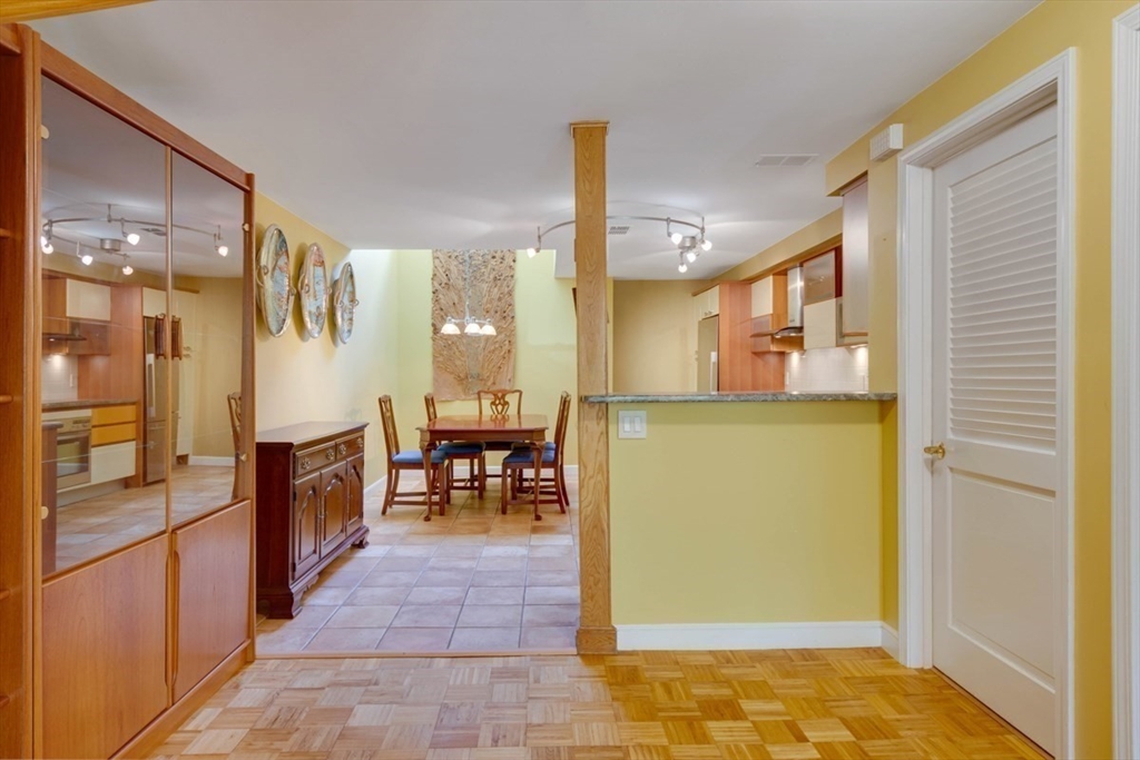 75 Page Road, Unit 16 Bedford, MA 01730 - Photo 6 of 27 a view of a hallway with dining area