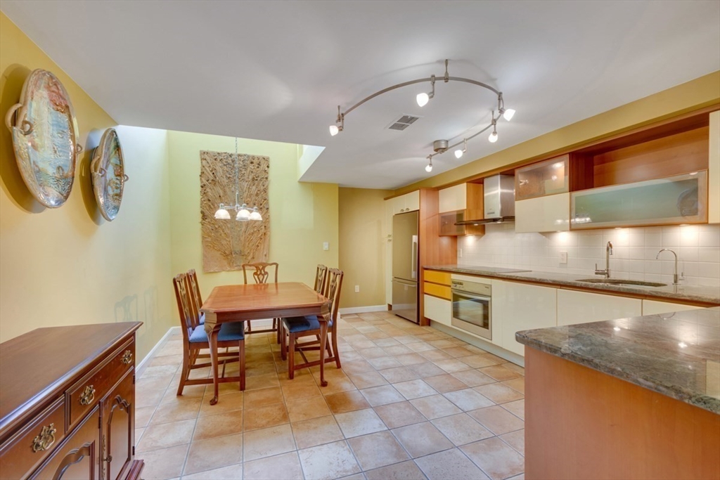 75 Page Road, Unit 16 Bedford, MA 01730 - Photo 7 of 27 a view of a dining room with furniture
