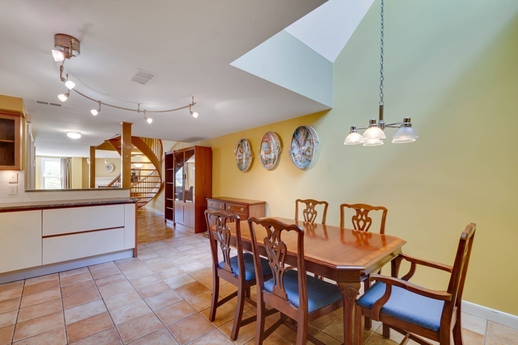 75 Page Road, Unit 16 Bedford, MA 01730 - Photo 9 of 27 a view of a dining room with furniture