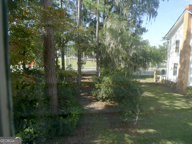 302 Jefferson Street, Unit B Springfield, GA 31329 - Photo 24 of 24 a backyard of a house with lots of green space