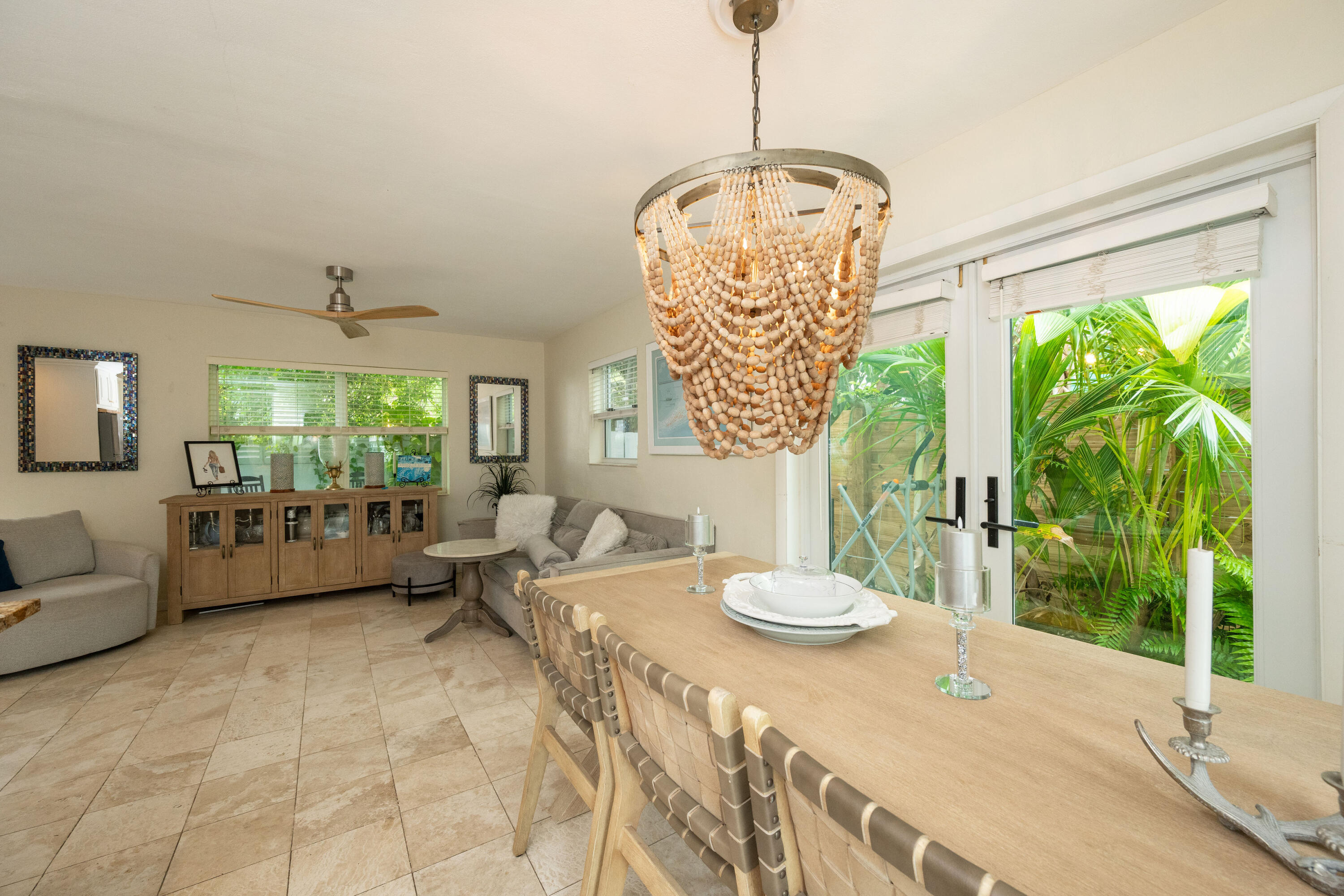 1523 Seminary Street Key West, FL 33040 - Photo 9 of 38 a living room with furniture and a chandelier