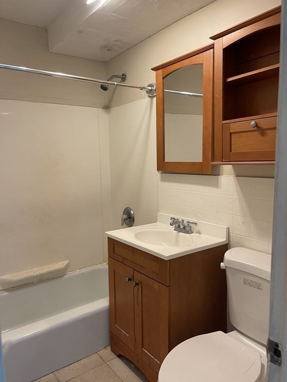 5 Turnpike Road, Unit 229 Townsend, MA 01469 - Photo 11 of 13 a bathroom with a sink a toilet and shower