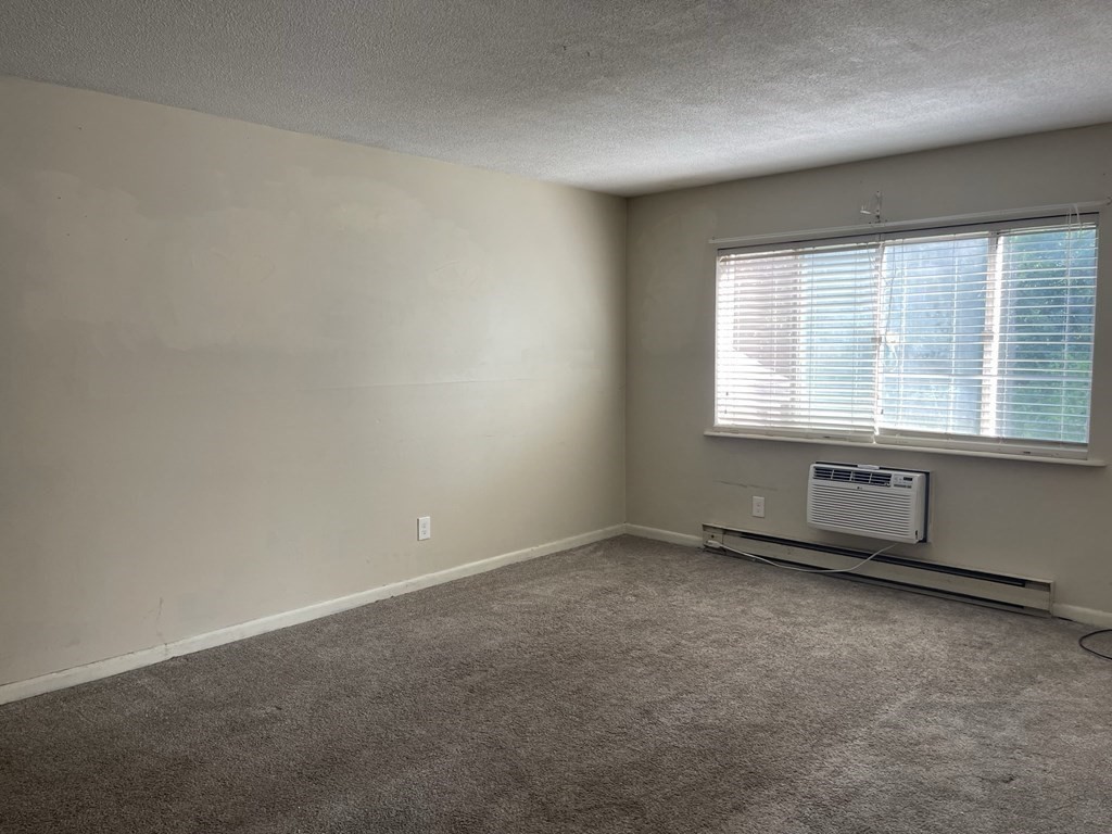 5 Turnpike Road, Unit 229 Townsend, MA 01469 - Photo 6 of 13 an empty room with a window