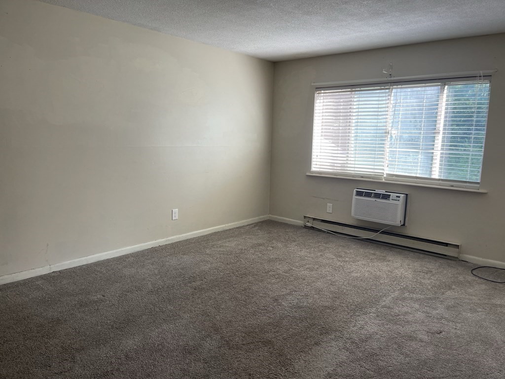 5 Turnpike Road, Unit 229 Townsend, MA 01469 - Photo 8 of 13 an empty room with a window