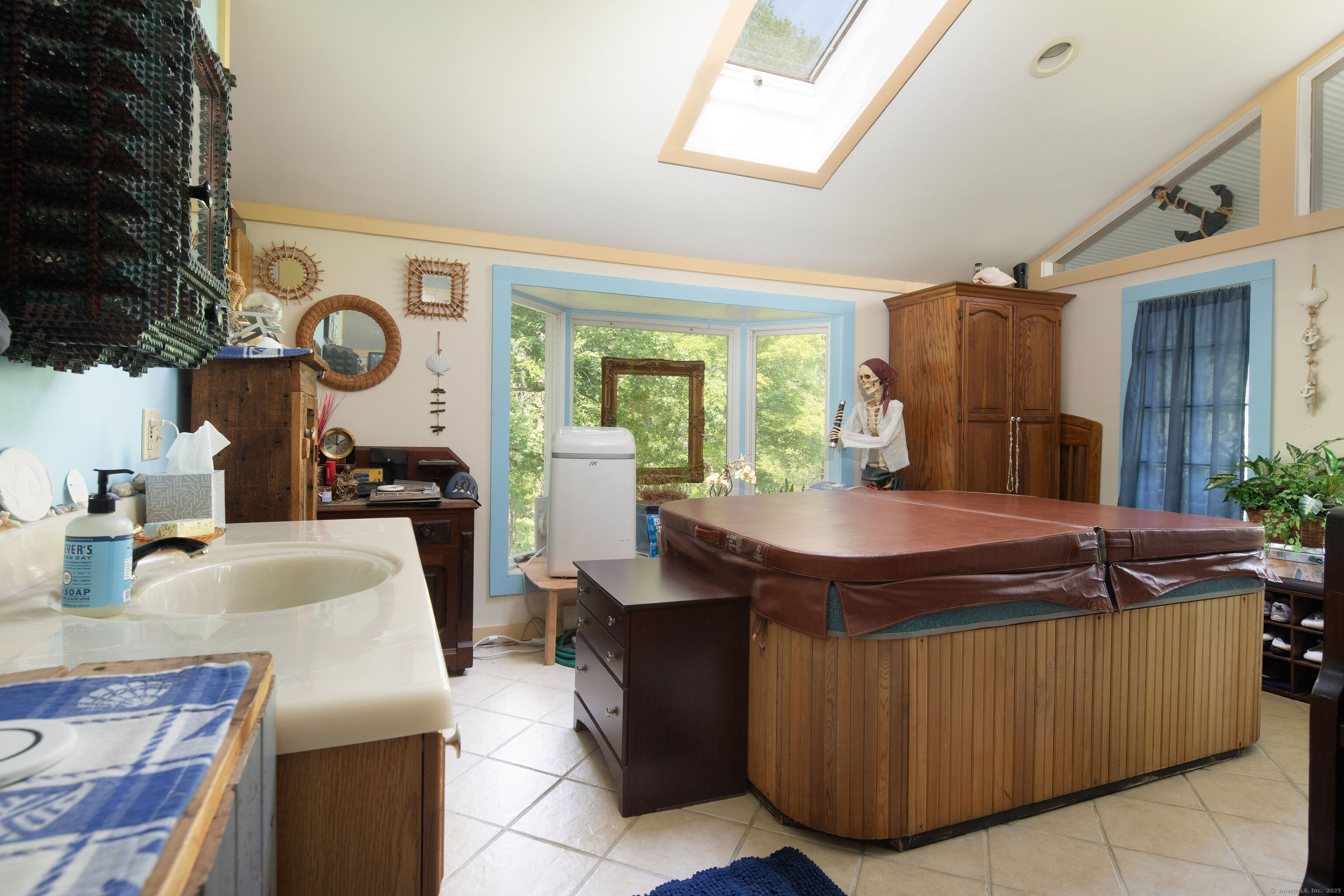 48 Preston Lane Salisbury, CT 06068 - Photo 26 of 36 a room with kitchen island a table and chairs