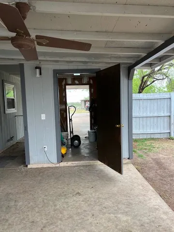 a view of backyard and tree