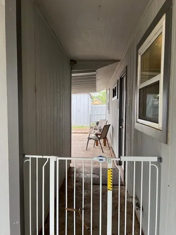 a view of a house with a tree and a yard