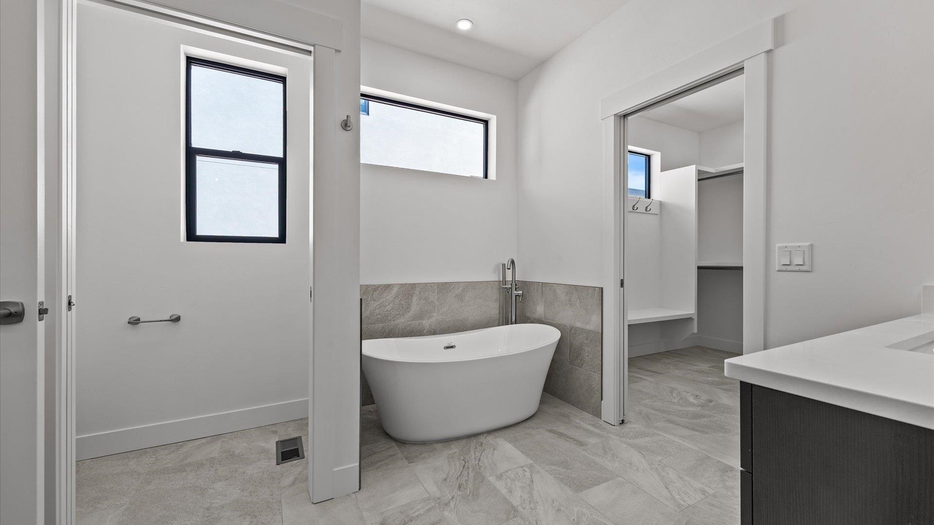 2045 Caleb Street Grand Junction, CO 81507 - Photo 23 of 42 a spacious bathroom with a bathtub and shower
