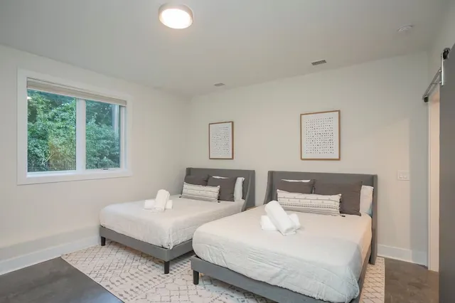 a bedroom with double bed and a window