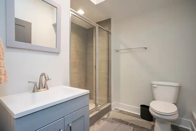 a bathroom with a sink toilet and vanity