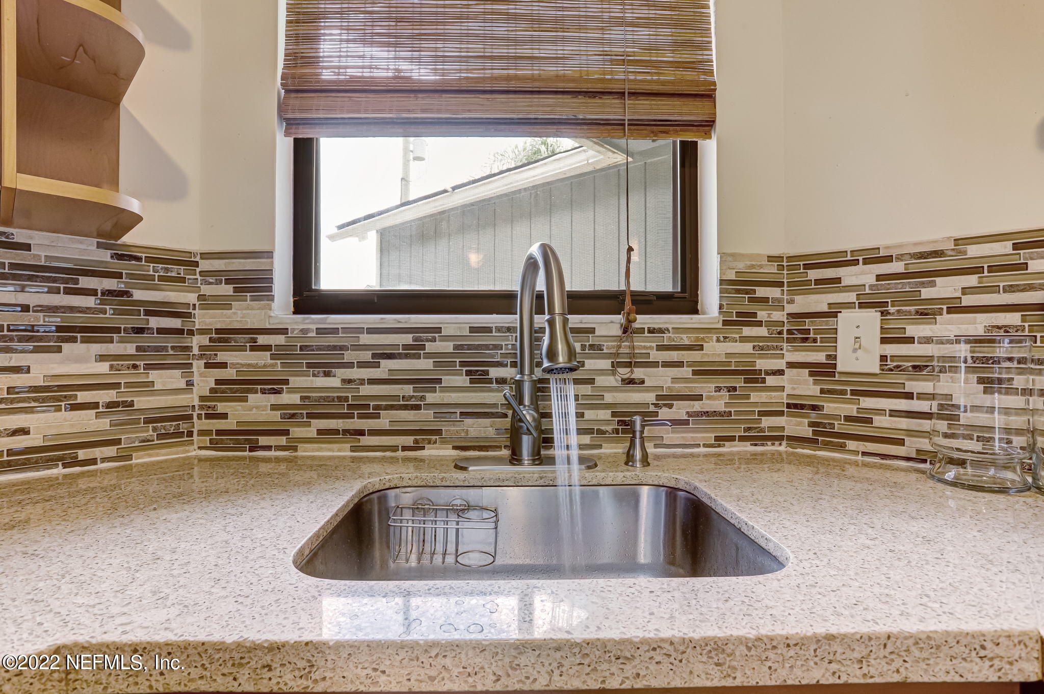 1756 Riley Street Jacksonville Beach, FL 32250 - Photo 14 of 44 a kitchen with sink and a wooden floor