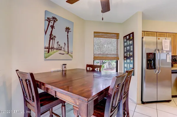 a dining room with furniture and window