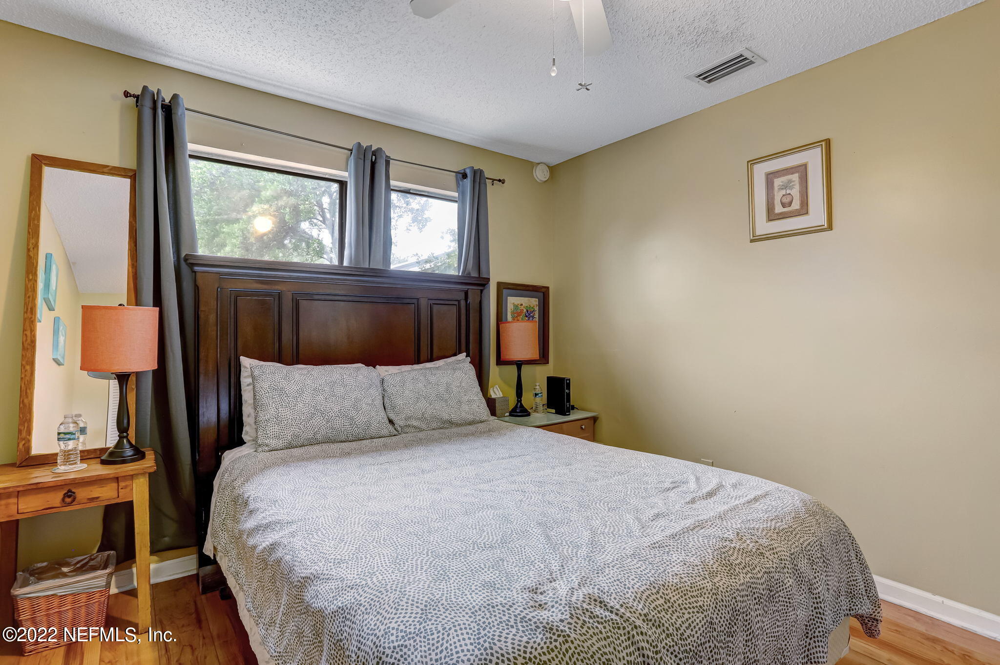 1756 Riley Street Jacksonville Beach, FL 32250 - Photo 21 of 44 a bedroom with a bed and a window