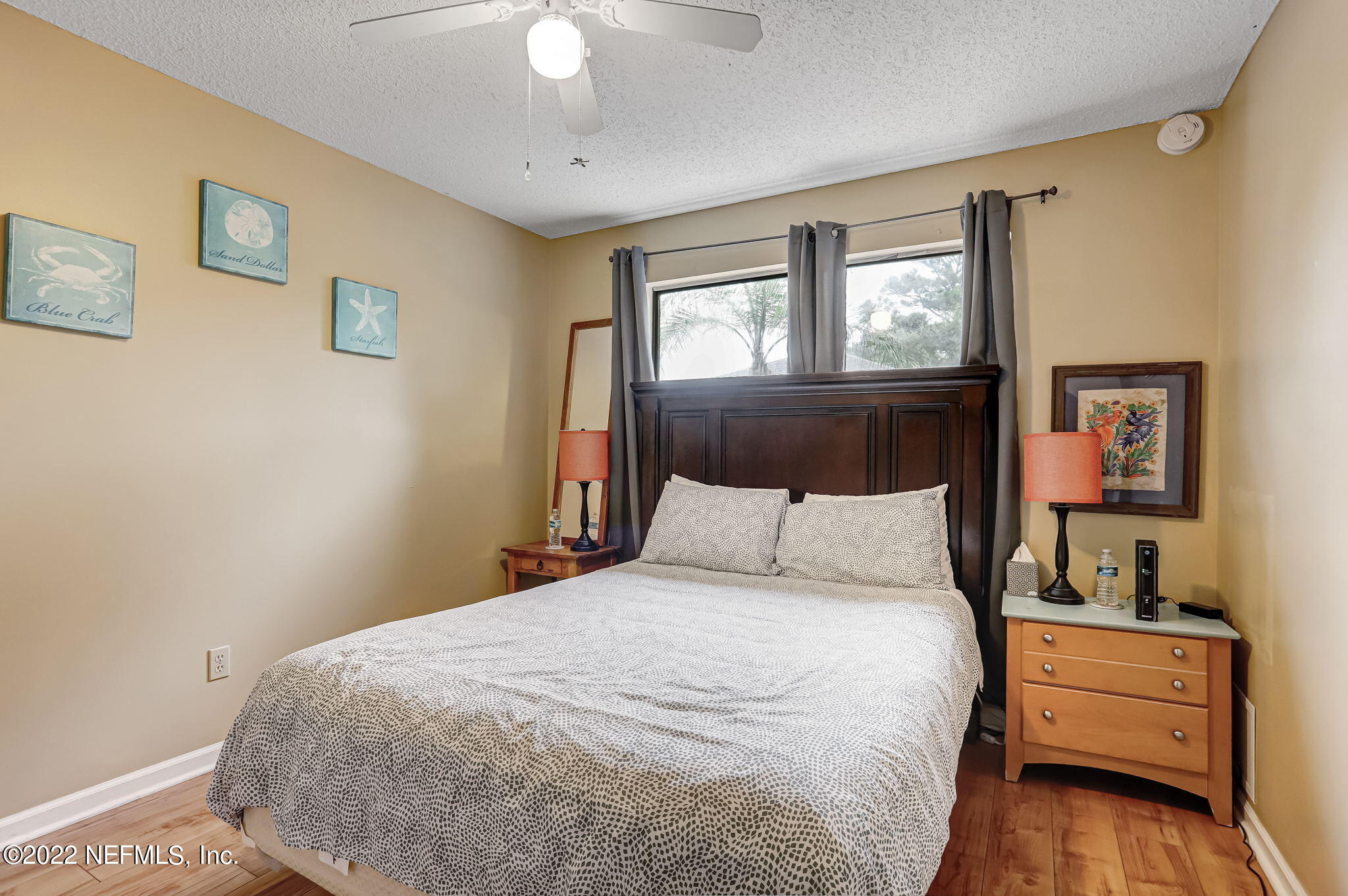 1756 Riley Street Jacksonville Beach, FL 32250 - Photo 26 of 44 a bedroom with a bed and a window