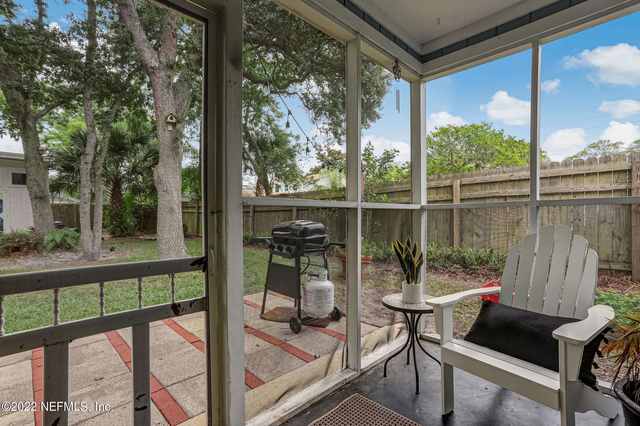1756 Riley Street Jacksonville Beach, FL 32250 - Photo 37 of 44 a view of a chairs and table in patio with a yard