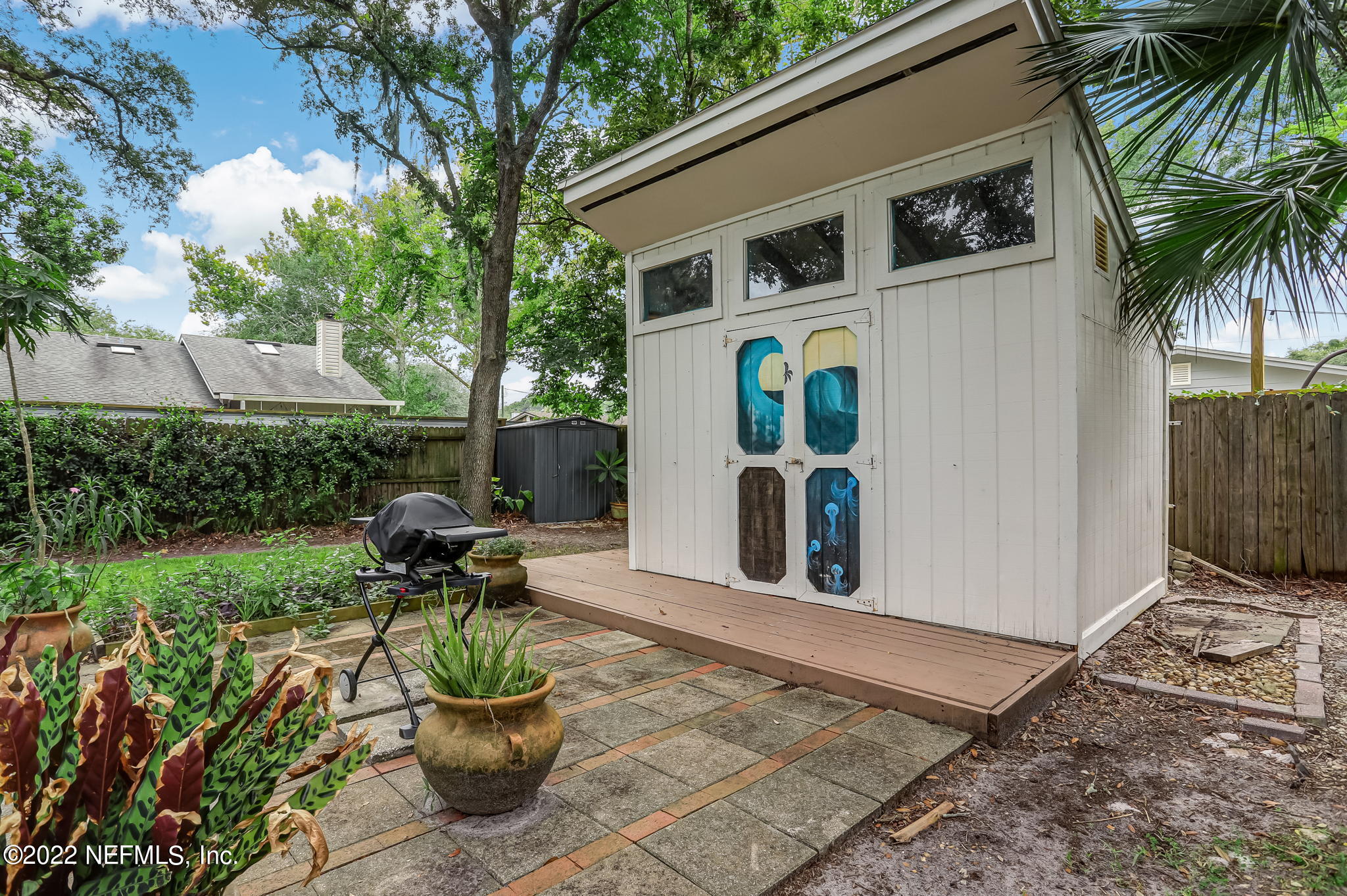 1756 Riley Street Jacksonville Beach, FL 32250 - Photo 40 of 44 a view of a patio with a table and a chairs
