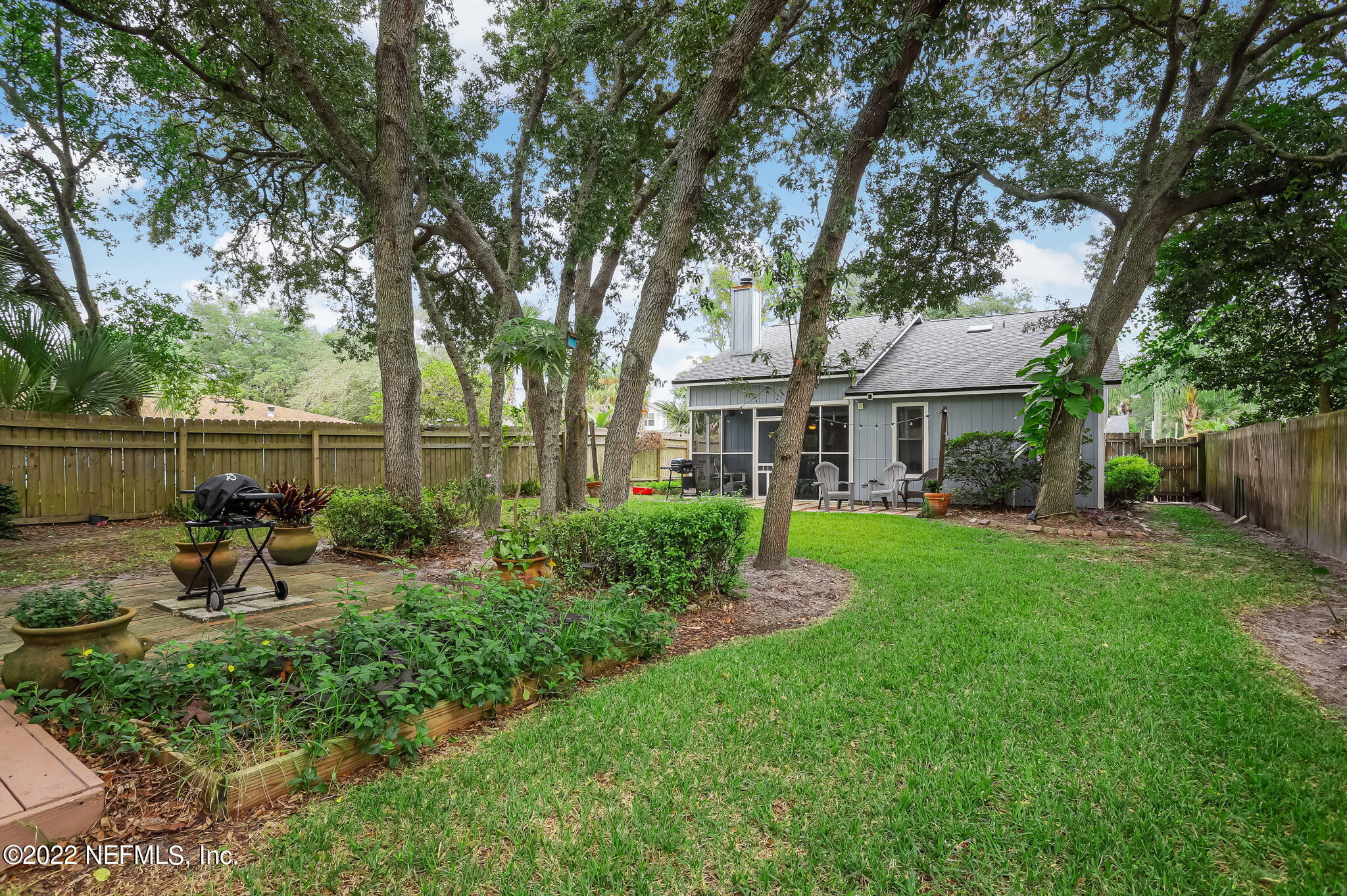 1756 Riley Street Jacksonville Beach, FL 32250 - Photo 41 of 44 a view of backyard of house with green space