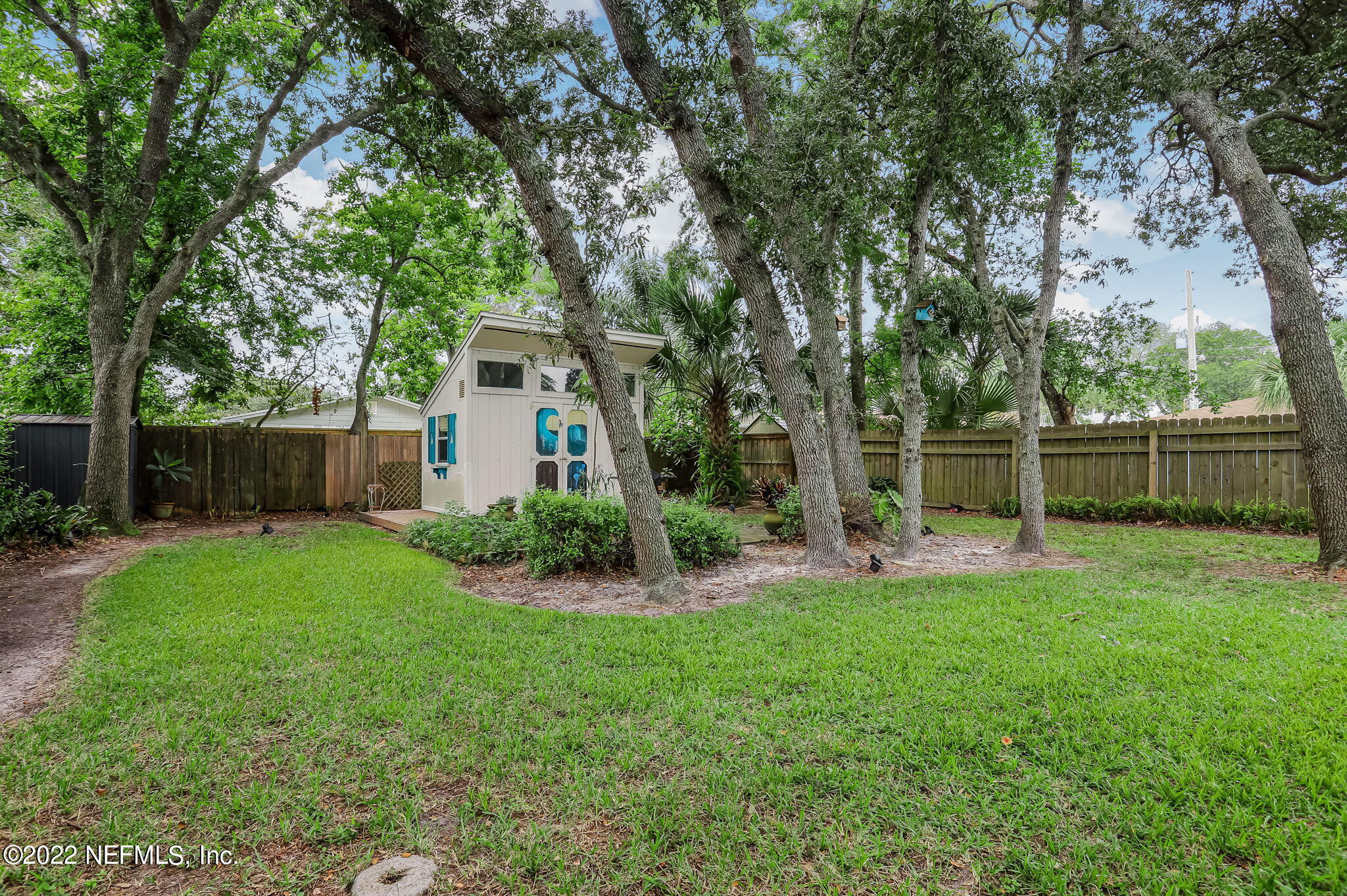 1756 Riley Street Jacksonville Beach, FL 32250 - Photo 42 of 44 a view of a house with backyard and a tree