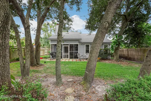a view of a house with backyard porch and garden