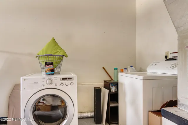 a utility room with dryer and washer