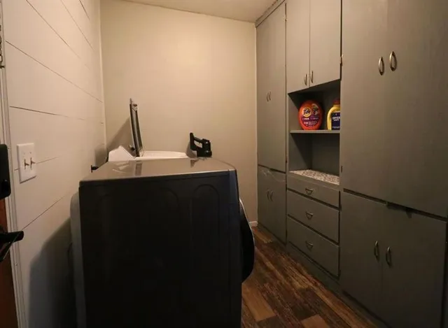a utility room with cabinets