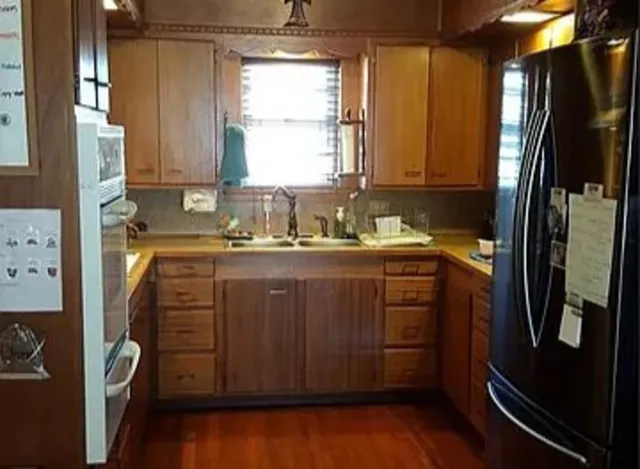 a bathroom with a sink a mirror and a shower