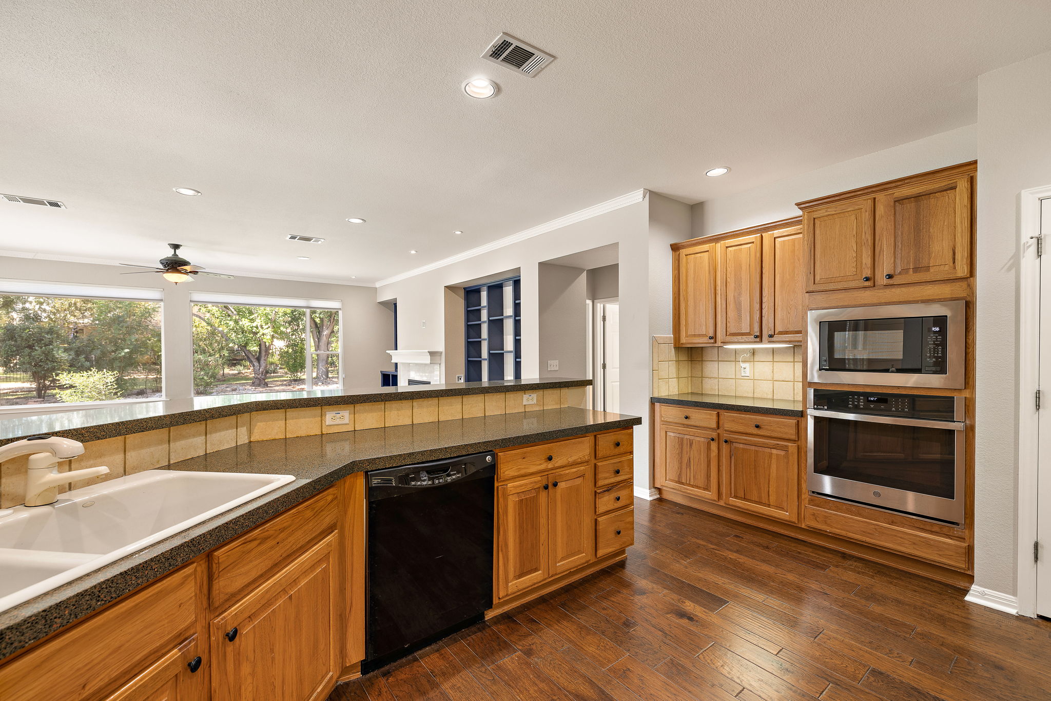 105 Liatris Lane Georgetown, TX 78633 - Photo 19 of 36 Stainless Microwave and Oven and plenty of counter space and pantry