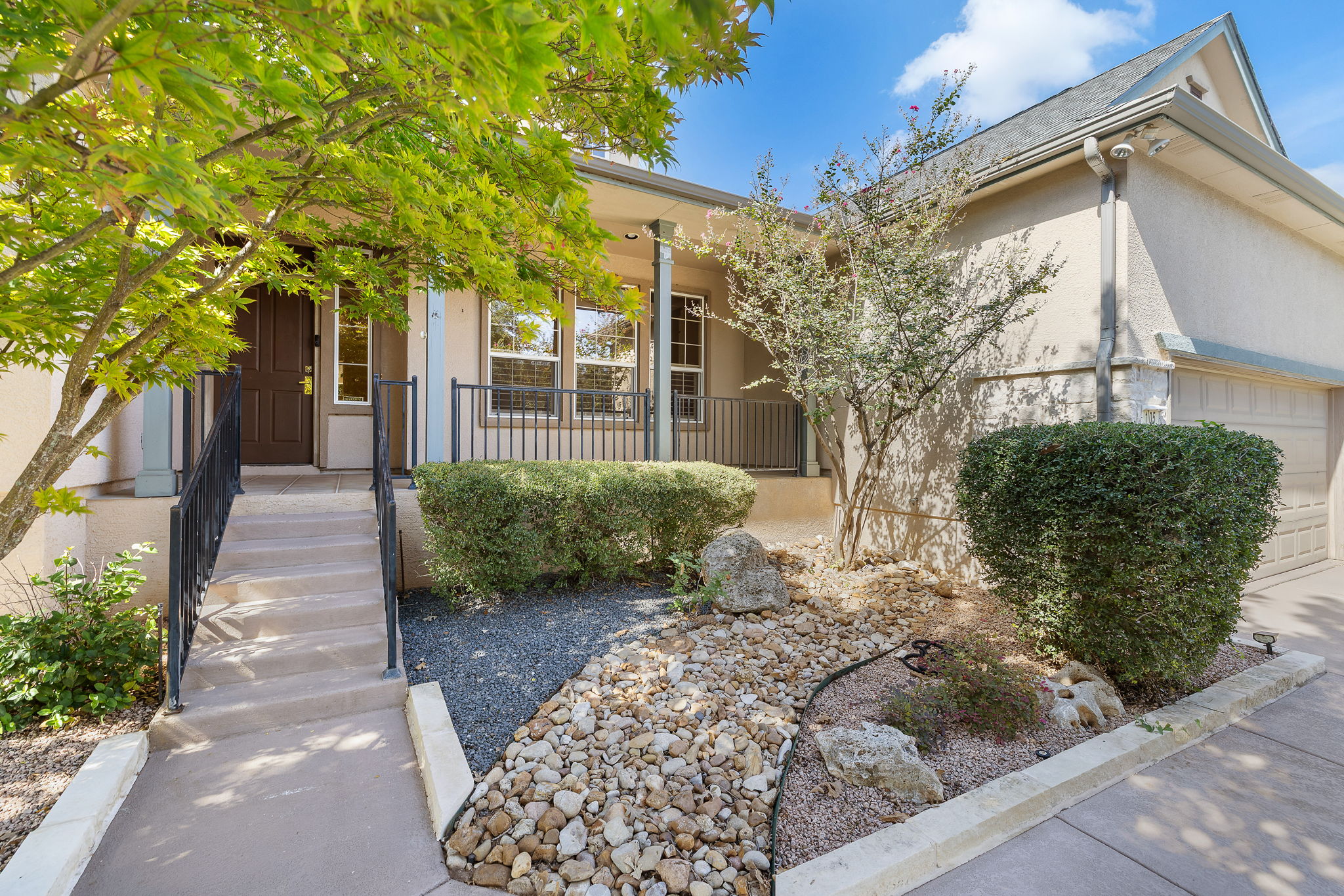 105 Liatris Lane Georgetown, TX 78633 - Photo 2 of 36 Xeriscaping in the front yard and an inviting porch