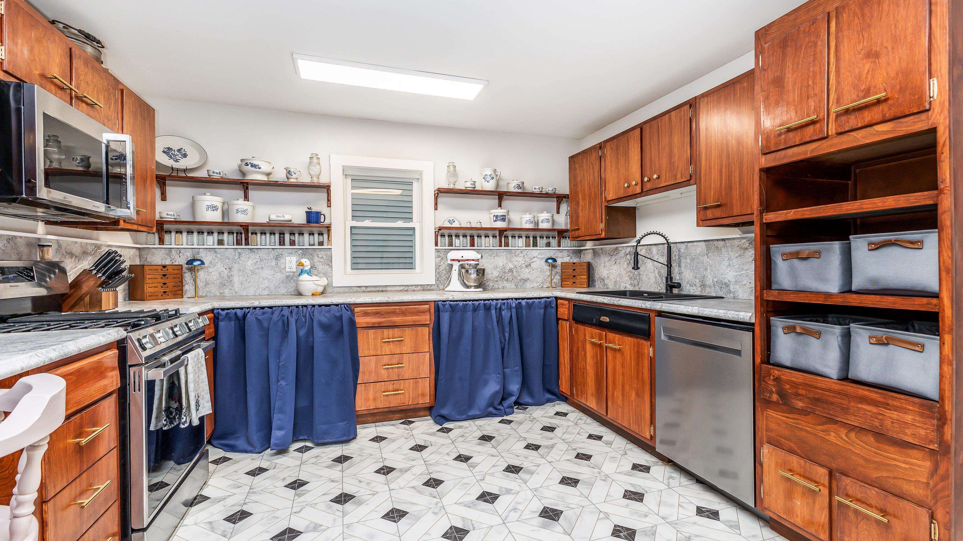 803 Ridge Street Galena, IL 61036 - Photo 16 of 40 a kitchen with stainless steel appliances granite countertop a sink stove and cabinets